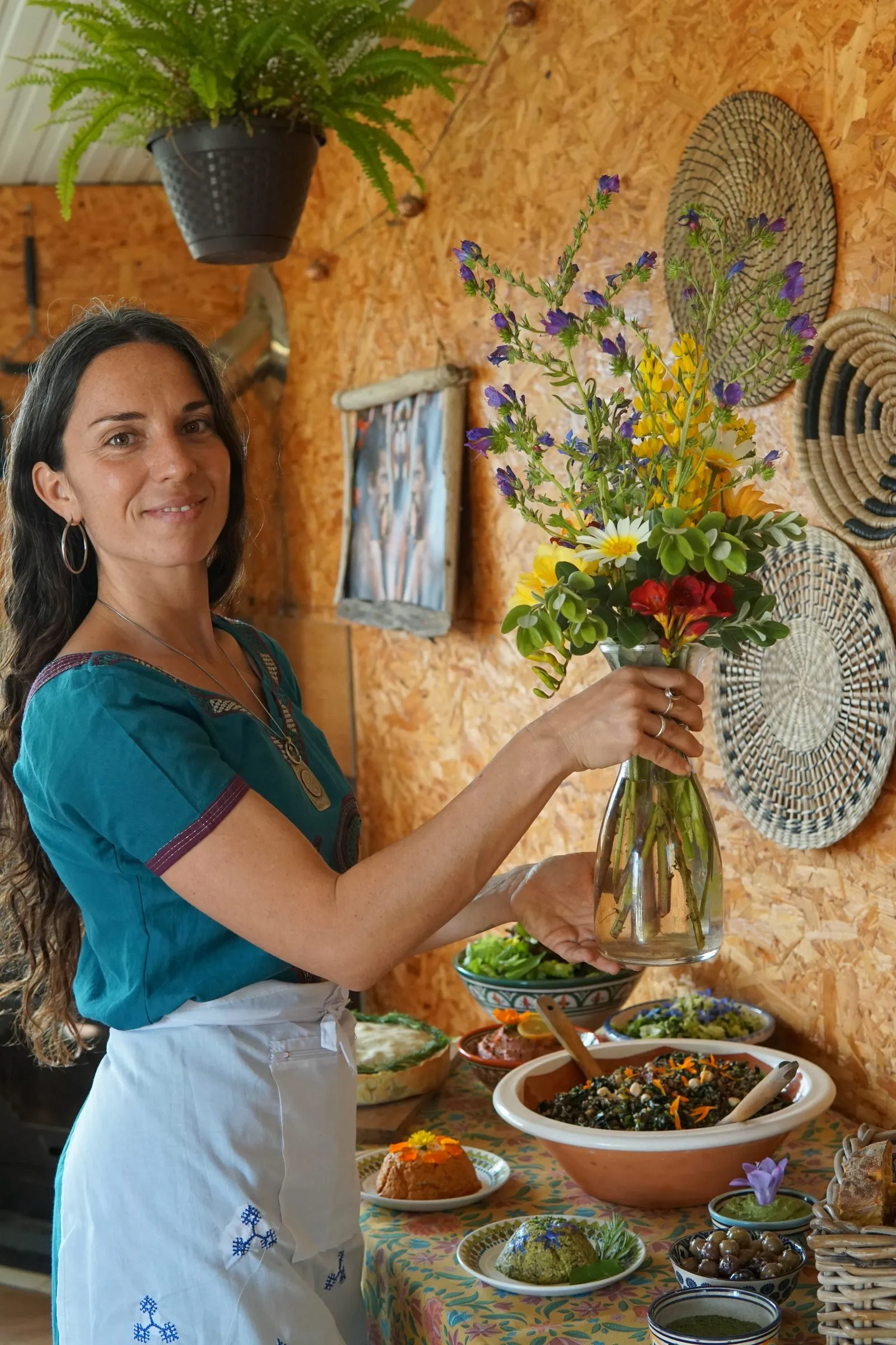 Melania with flowers and a vegetable dish