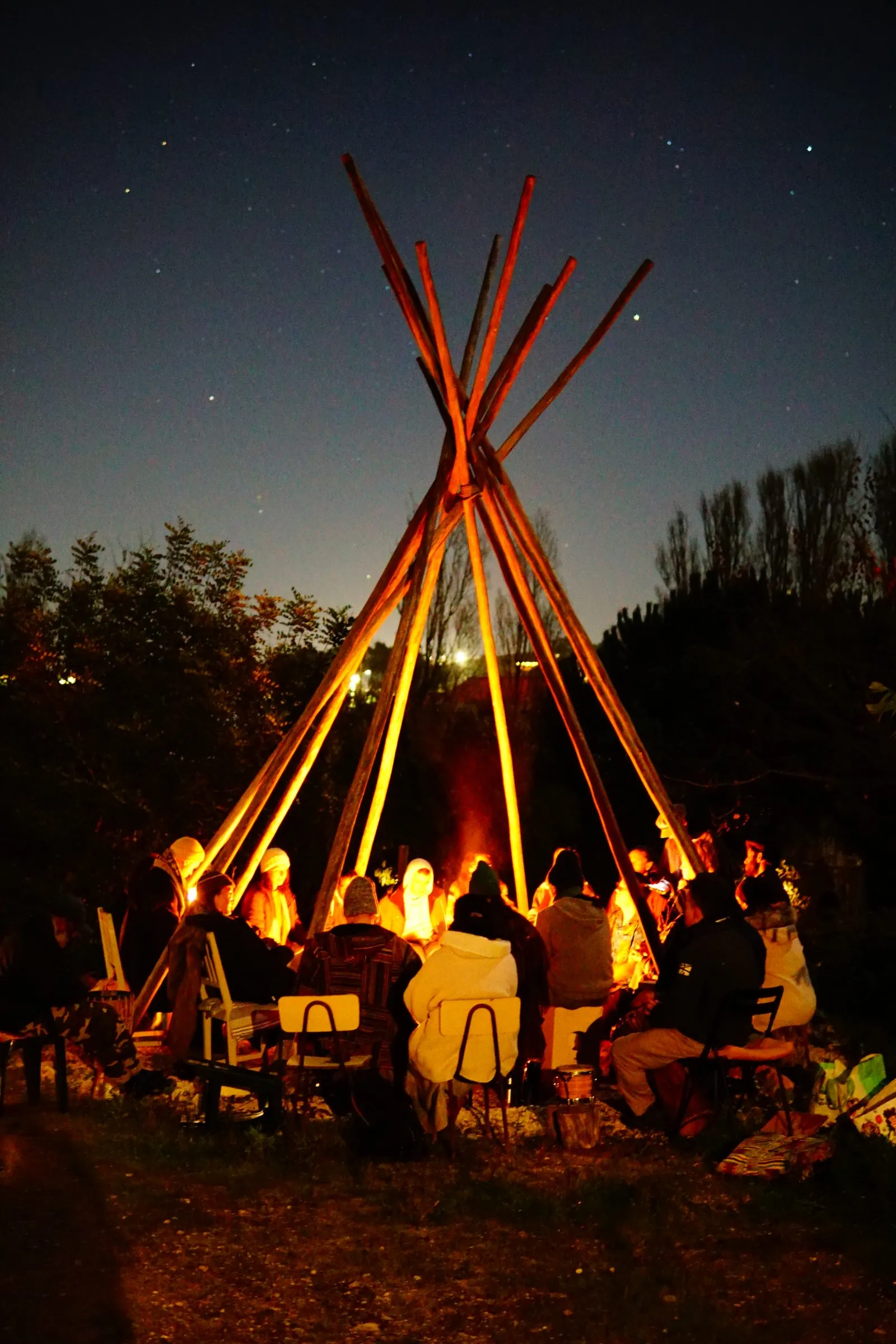 The fire under the tipi at night